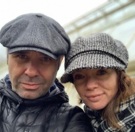 Andrew and a female companion who is presumably his wife or partner taking selfie